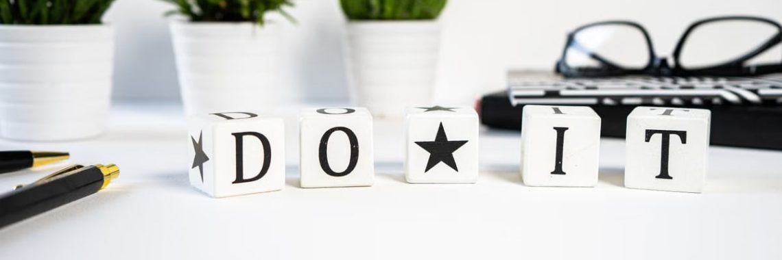 Inspiring office scene with 'Do It' blocks and plants, perfect for motivation.